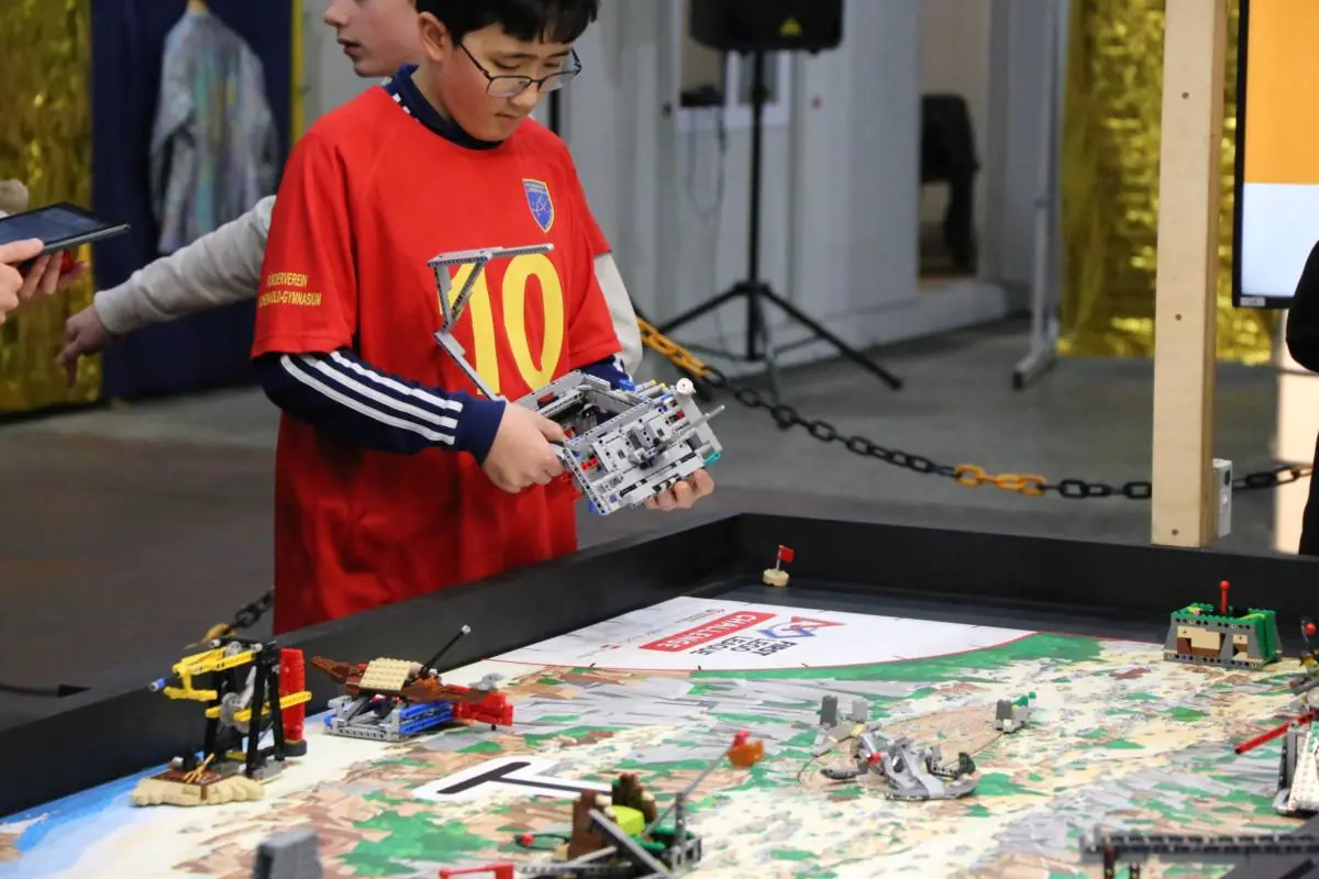 Child presenting a LEGO model