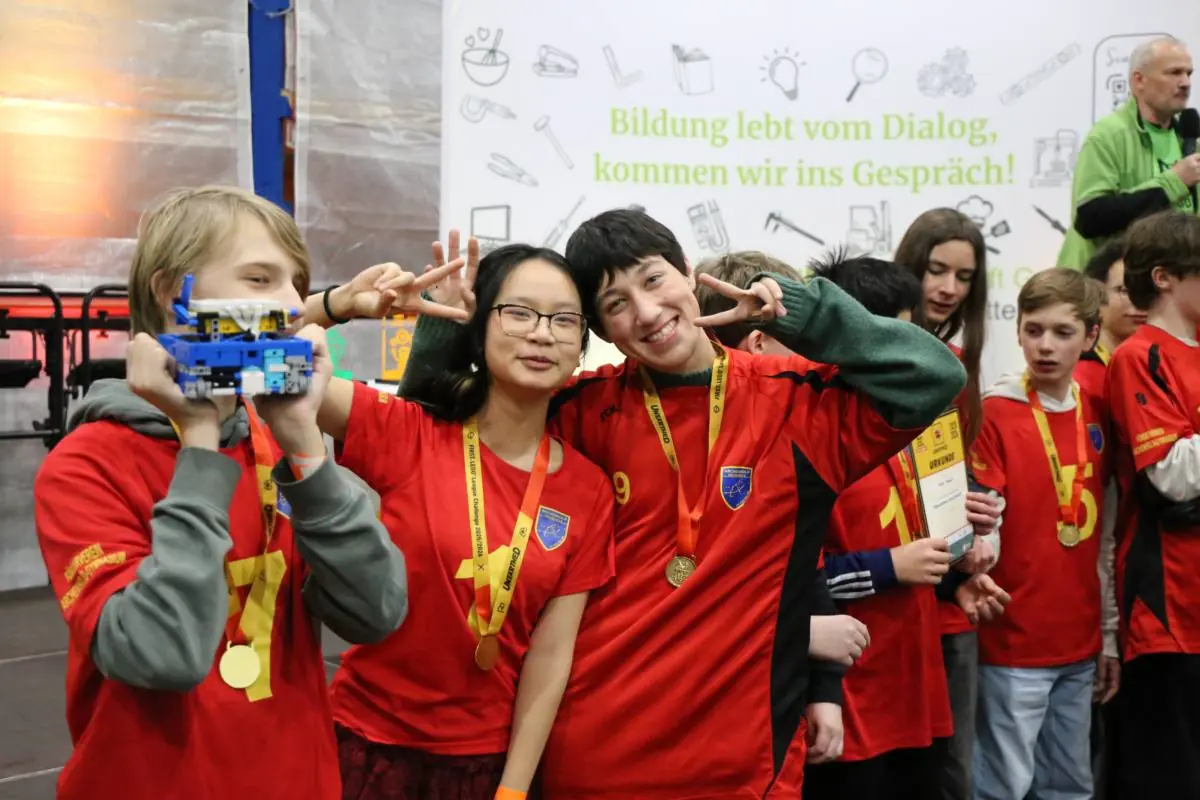 Participants with medals and certificates after the competition